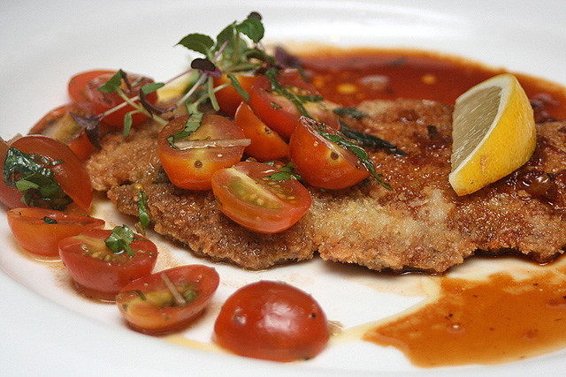 Breaded Veal Scallopine pan fried in Butter Glace with Veal Jus, Cherry Tomato Salsa & Lemon Wedge