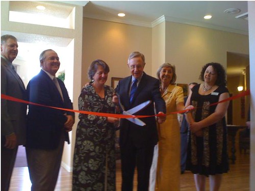 From Left to Right:  Lakeview Terrace Owners Gary Lanzen and Allan Richardson are joined by Deputy Secretary Kathleen Merrigan, U.S. Senator Harry Reid, Congresswoman Dina Titus, and Lakeview Terrace General Manager Teri  Stoneback in cutting the ribbon at the Grand Opening Celebration.  