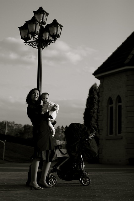 a mum, lampost and a baby
