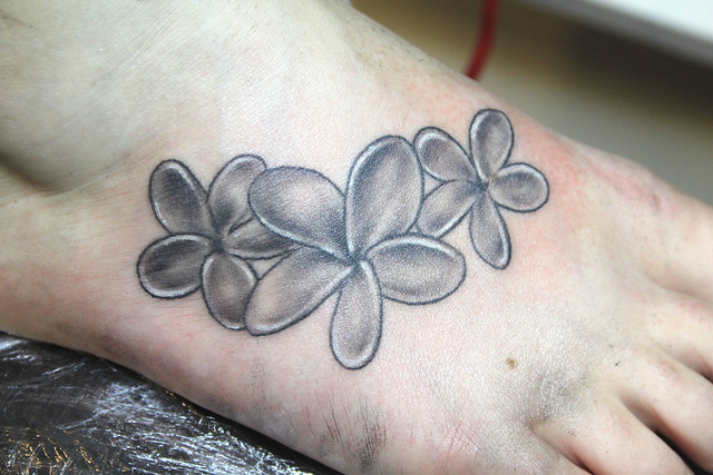 frangipani flower tattoo by Mirek vel Stotker