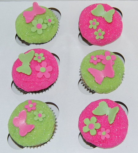 bright pink and green glitter cupcakes with butterflies