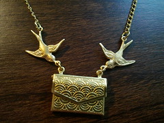 gold swallow necklace with envelope pendant