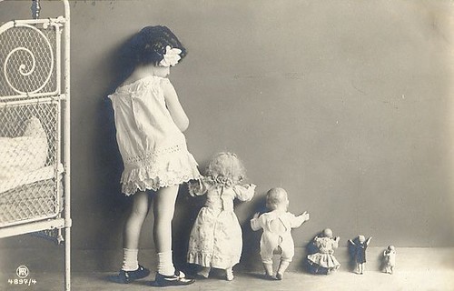 vintage photo girl with dolls