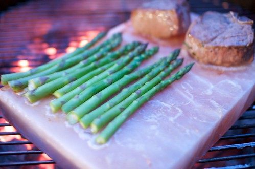 asparagus and lamb grilling on salt block
