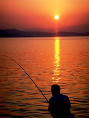 Fisherman at sunset - Edipsos Port