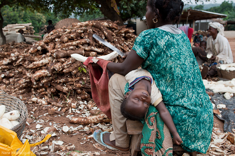 Cassava Peeler and Sleeping Child