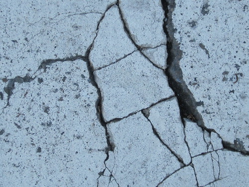 Cracks in a Blue Concrete Wall