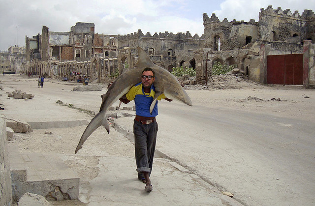 Jim Groom carries a shark