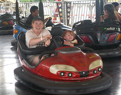 Mom with crazed look and Speck hanging on in a bumper car