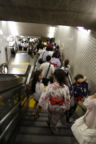 Girls in Yukata entering the Kudanshita station