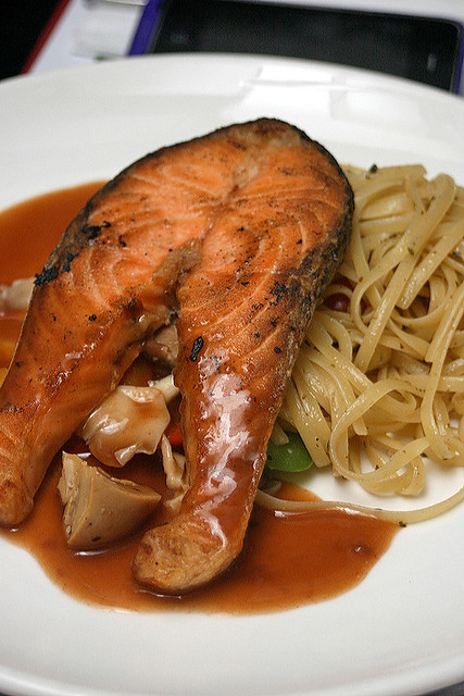 Maple mustard salmon steak with linguini in homemade pesto