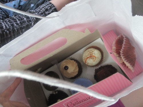 Eating a cupcake in the cab, on the way to the restaurant (cupcakes brought by France)