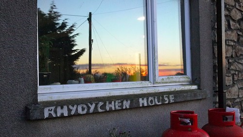 sunset reflected in the kitchen window