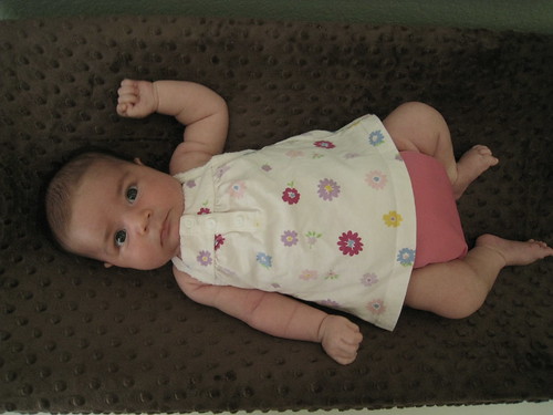 The cloth diaper is a perfect accessory to her cute dress