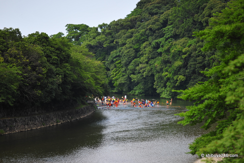 Back in the main river, a group of people were enjoying the cool water