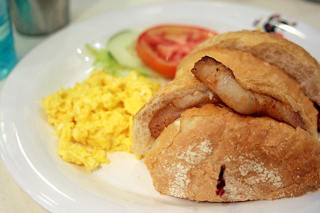 Macanese crispy roll with pork chop and scrambled eggs