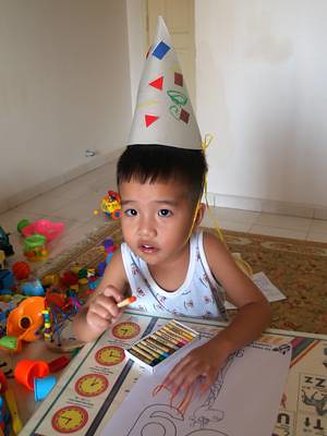 Julian with party hat