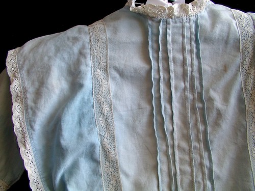 front detail of lace and pin tucks