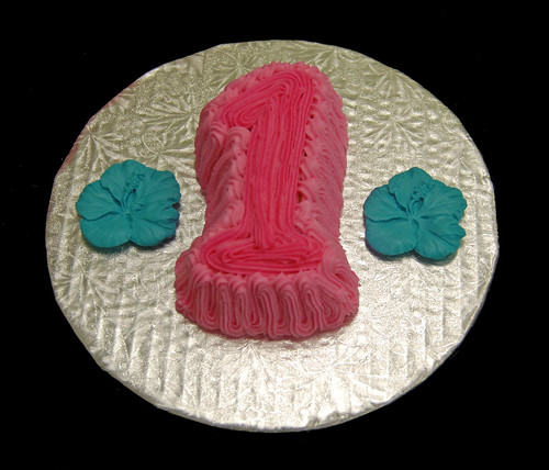 1 shaped smash cake for luau themed celebration