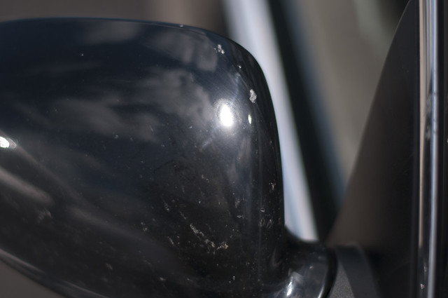 Dents on top of passenger mirror