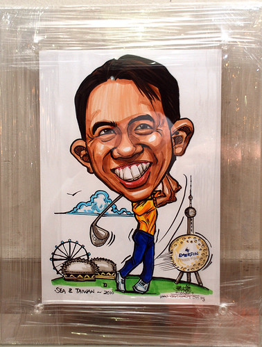 golfer caricatrure for Emerson Process Management in clear acrylic frame