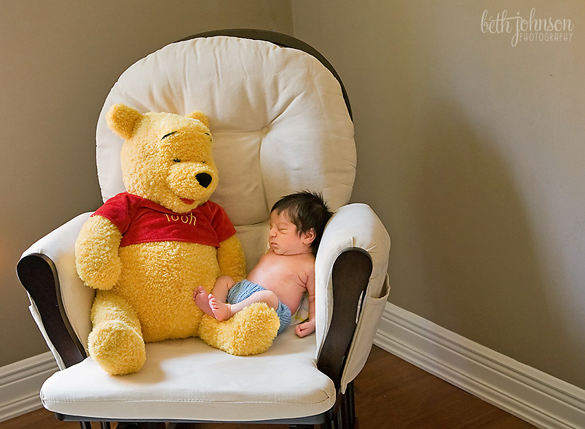 newborn baby boy with winnie the pooh