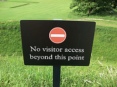 A sign in a field which says: no visitor access beyond this point