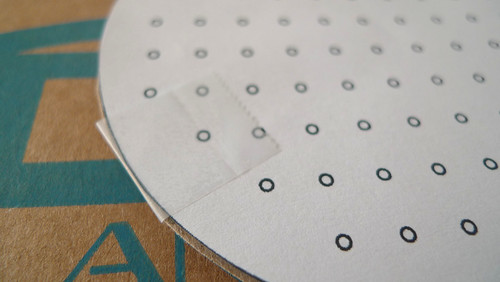 4. tape template to coaster