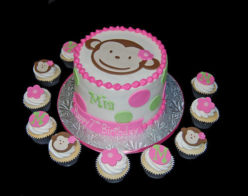 pink and green polka dot monkey cake and cupcakes