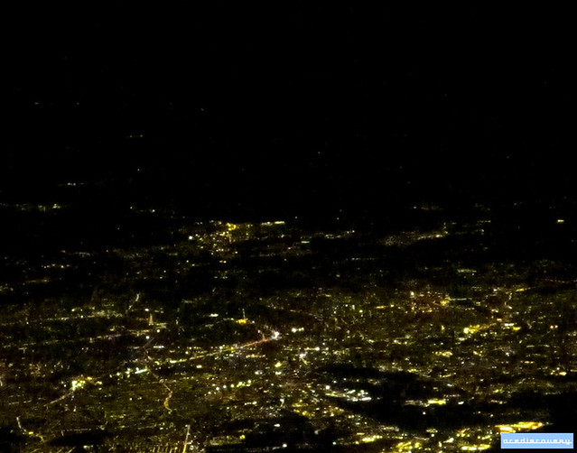 Paris by night from above. Eiffel Tower can be seen in left lower middle 