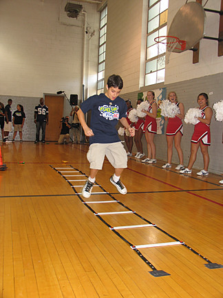 Students compete in the obstacle course as part of the Fuel Up to Play 60 kickoff event in Dallas.