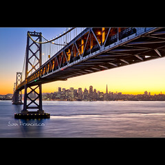 Sunset in San Francisco Skyline under the Bay Bridge