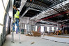 Contractor installs tracks for drop ceiling