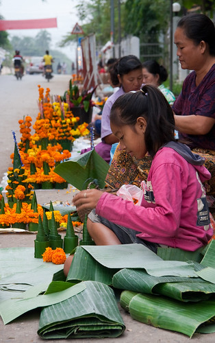 Girl creating offerings for a temple