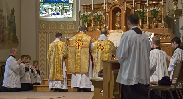 Father David Kemna, FSSP, at Saint Francis of Assisi Catholic Church, in Portage des Sioux, Missouri, USA - Prayers at the foot of the altar