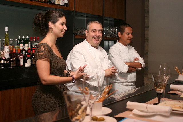 Santi (centre) flanked by his daughter and his staff