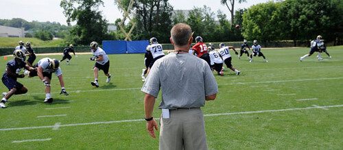 Coach Spagnuolo watches over the Rams in training camp. Photo from stlouisrams.com