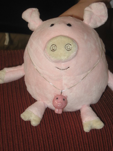 Abbey the pig wearing a piggy pendant