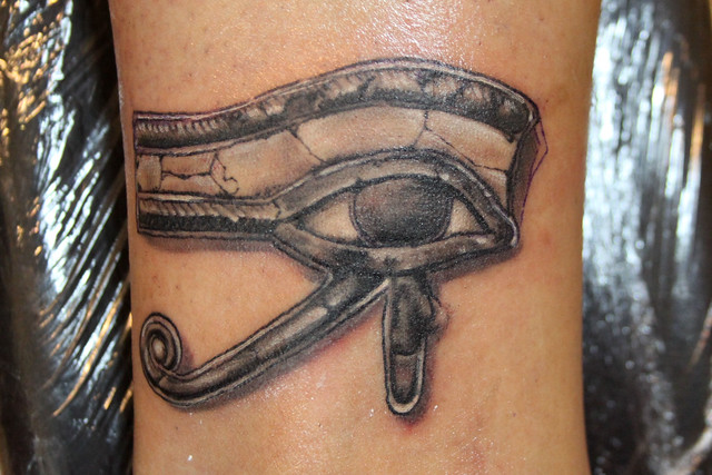 It looks like a prison/gang tattoo . It's the Eye of Horus .