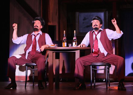 NYC guest artist David Spangenthal (Bobby Child) in his Bela Zangler disguise, in the saloon next to Tony Young, the real Bela Zangler.  In this comical scene, the two Zanglers drink away their sorrows, each believing the other is his mirror image.