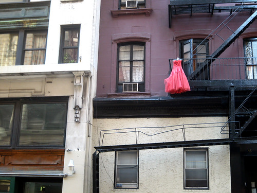 red dress hanging off balcony