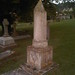 Weathered and eroded memorial at West Hill Cemetery. The Masonic symbols remain. The names have gone.