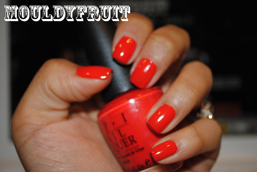 red nail polish meaning. an orangey/red nail polish