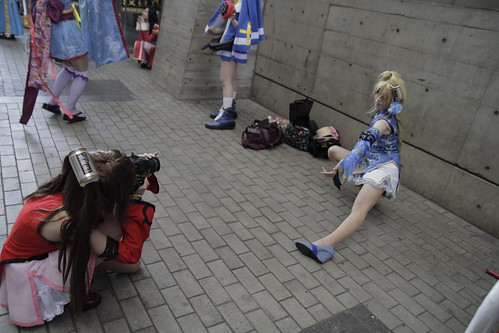 One cosplayer taking photo of another