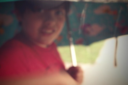 my son, hogging the umbrella