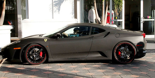 I don't know about his singing but Justin Bieber's flat black Ferrari F430