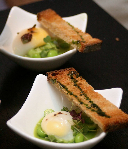 Touts Petit Pois en Demi - Poached quail's egg on green pea gelee, creamed green pea puree, and green pea with mustard cress salad, served with toast and basil oil