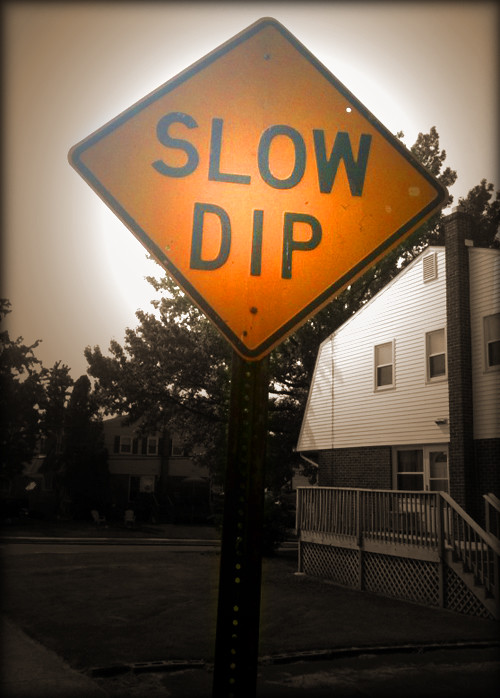 slow-dip-road-sign