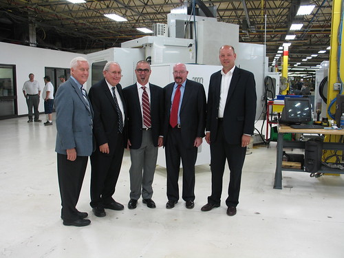 (From left):  SMI Co-owner Jerry Carlson, U.S. Sen. Carl Levin, SMI President Dodd Russell, USDA Rural Development State Director for Michigan James J. Turner, and The Bank of Northern Michigan Vice President for Business Banking Wade Van Houzen.