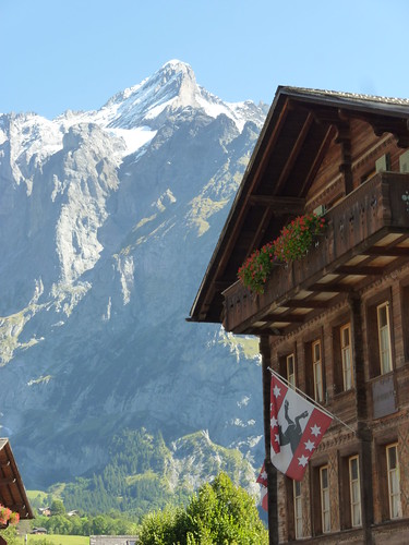 Chalet and painted backdrop of a mountain